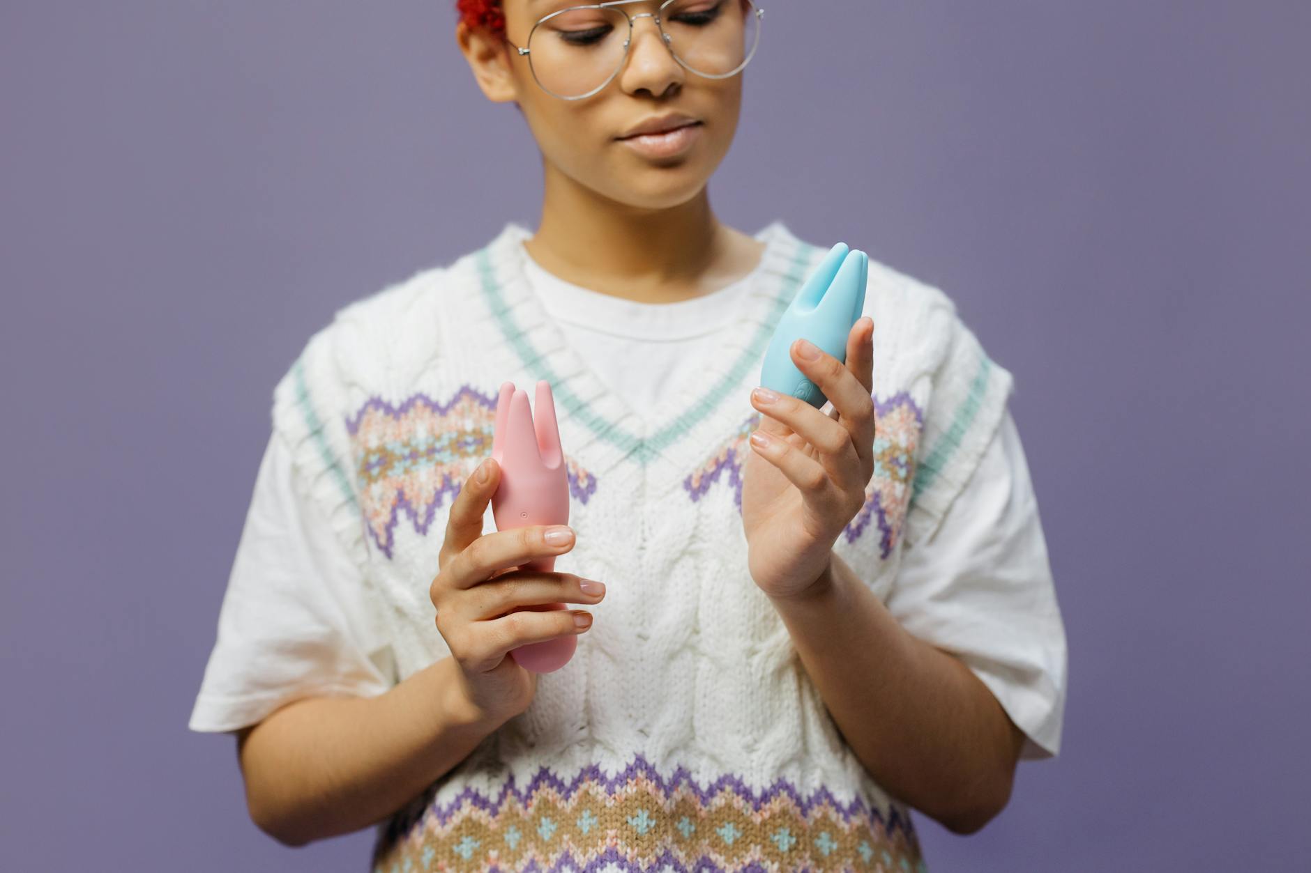 Woman holding lemon sexual toys, exploring pleasure and sensation across hormonal cycles.